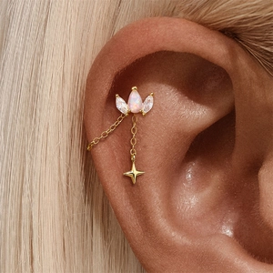 Detailed macro view of S925 silver star pendant drop earring with opal and zircon studs