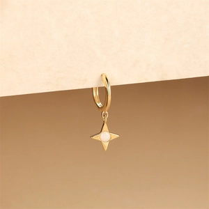 Macro view of gold plated S925 silver earring with a North Star pendant and opal stone