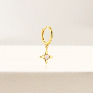 Close-up of gold S925 sterling silver hoop earring with star-shaped opal stone pendant