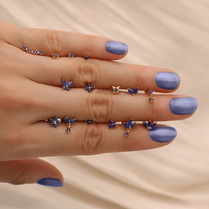 Detailed view of small S925 silver gold-plated stud earrings with blue lapis lazuli