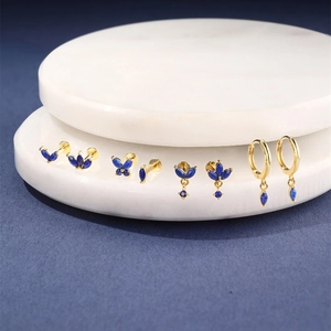 Detail of s925 silver hoop earrings with natural marquise lapis lazuli on stone tray