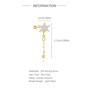 Detail view of gold-plated S925 silver earring with blue opal flower and star tassel