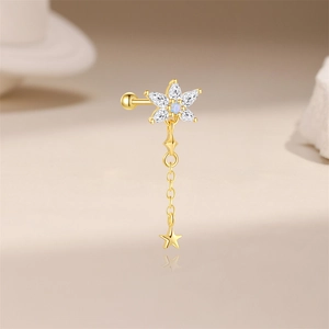 Close-up of gold flower stud earring with blue opal, zircon petals and star chain