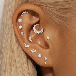 Detailed close-up of s925 silver nose rings and daith hoops set with sparkling cubic zirconia