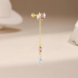 Detailed close-up of golden tassel ear stud with purple marquise zircon and drop crystal
