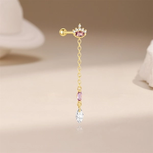 Detail of gold tassel earring with purple gemstone crown and sparkling water drop zircon