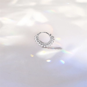 Detail of S925 sterling silver hoop with double row moissanite under rainbow light