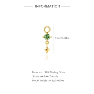 Dettaglio pendente in argento S925 con zircone verde e ciondolo a stella dorata