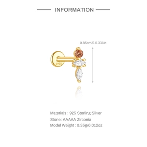 Macro detail of S925 sterling silver dinosaur earring with colorful zircon stones