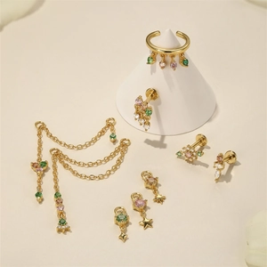 Close-up of S925 silver earrings with gold plating, tassels, and colorful zircons