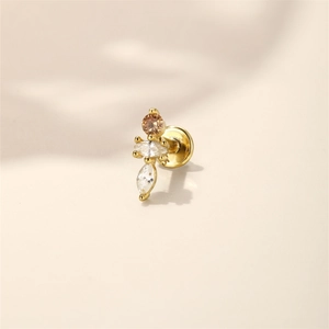 Macro shot of gold flat back stud featuring champagne and marquise-cut stones