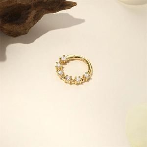 Detail of s925 gold-plated sterling silver hoop with seven sparkling round cubic zirconia
