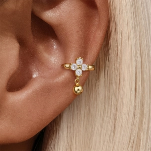 Detail of S925 silver gold clover ear cuff featuring zircons and round metal pendant