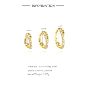 Detail of 925 sterling silver gold-plated crossover hoop earrings with AAAAA cubic zirconia
