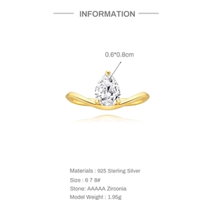 Macro detail of pear-cut white zircon stone in gold plated S925 sterling silver ring