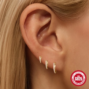 Three-piece S925 sterling silver gold hoop earrings with white zircon on a model ear