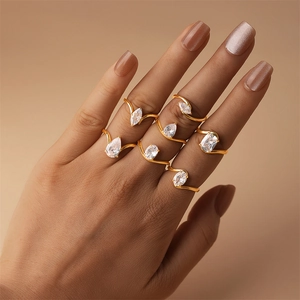 Close-up of gold S925 silver rings set featuring teardrop and marquise zircon stones