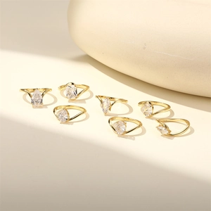 Macro detail of S925 engraved gold-plated silver rings with various cubic zirconia cuts