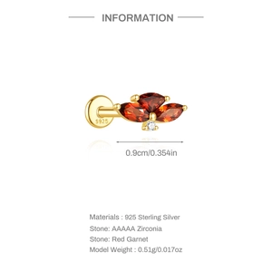 Macro detail of S925 silver labret earring featuring marquise red garnet stones