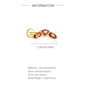 Detailed view of S925 sterling silver ear stud with red garnet and zirconia stones