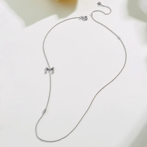 Elegant S925 sterling silver necklace featuring a sparkling zircon pavé letter M pendant