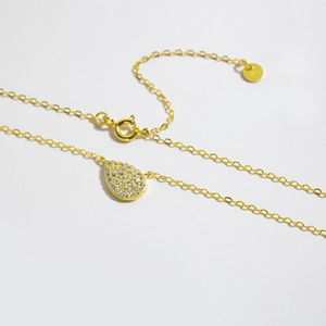 Exquisite S925 sterling silver gold pear drop necklace featuring sparkling pavé crystals