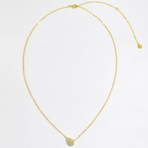 Close-up of S925 sterling silver pear-shaped pendant with pave-set stones on gold chain
