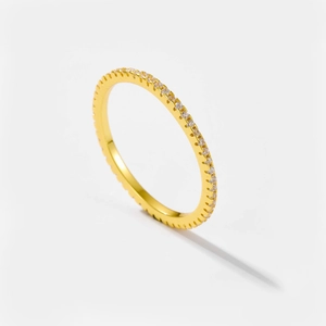 Close-up of a slim gold-plated S925 silver ring with pavé set white zircon stones