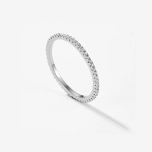 Detailed macro view of S925 sterling silver eternity ring with pavé-set cubic zirconia