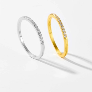 Macro detail of silver and gold eternity rings with cubic zirconia and S925 hallmark