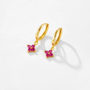 Detailed view of S925 silver flower earrings with pink zircons and gold finish