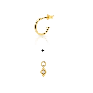 Detailed view of 925 silver gold-plated C-shape hoop and geometric diamond pendant