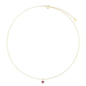 Detail of gold necklace with lobster clasp and three red circular stone pendants