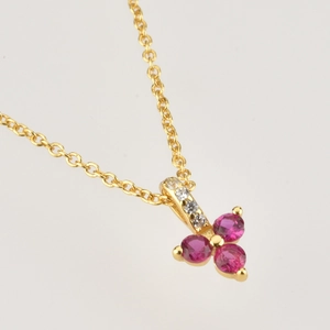 Golden S925 sterling silver necklace with three-petal pink stones and zircon accents