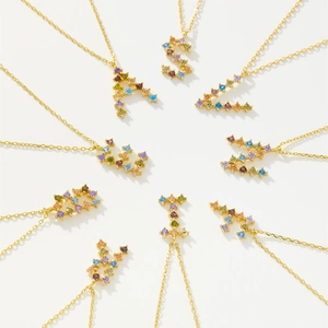 Rainbow CZ micro-paved A-Z initial letter necklaces with gold-plated chains in starburst layout