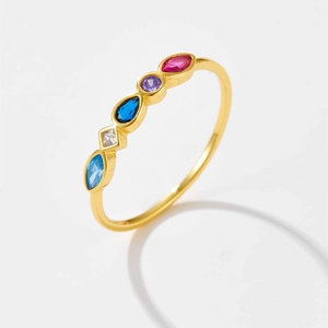 Close-up of gold-plated silver ring featuring five multi-colored zircon gemstones