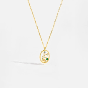 Detail of gold S925 sterling silver necklace with colorful zircon stones in oval pendant