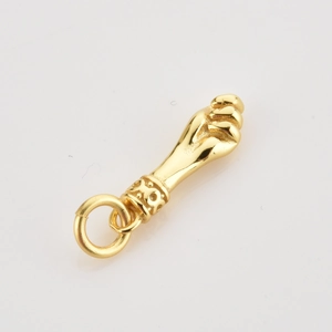 Detailed view of the gold-plated Figa hand pendant featuring an intricate textured base