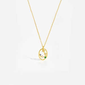 Macro detail of gold S925 sterling silver necklace with colorful zodiac crystals
