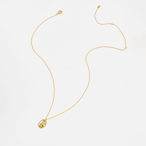 Detail view of a fine gold S925 sterling silver chain with a colorful zircon pendant