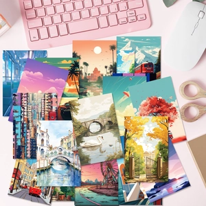 Flat lay of artistic cartoon street landscape postcards on a desk with office stationery
