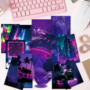 Detail view of 50 purple aesthetic cyberpunk wall collage cards on a pink desk
