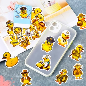 Detailed close-up of waterproof yellow duck cartoon stickers on a matte phone case