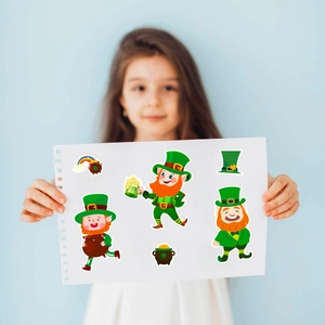 Girl holding St. Patrick's Day DIY sticker sheet featuring leprechauns and rainbows