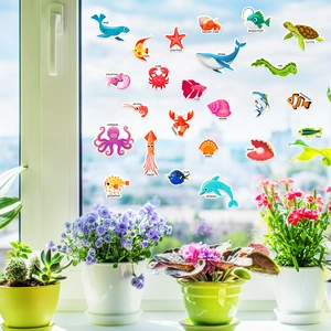 Detailed view of colorful ocean animal jelly stickers applied on a glass window surface