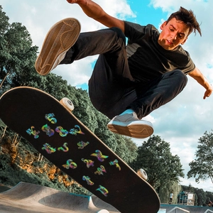 Dynamic view of reflective laser stickers with numbers and letters on a skateboard deck
