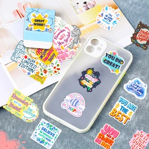 Close-up of colorful inspirational English quote stickers on a matte phone case