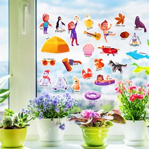 Detail of colorful jelly stickers on a window with animal and plant English labels