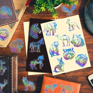 Autocollants holographiques d'animaux avec motifs laser d'éléphant sur bureau en bois