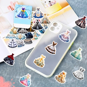 Detail of colorful Lolita dress stickers on phone case and notebook background